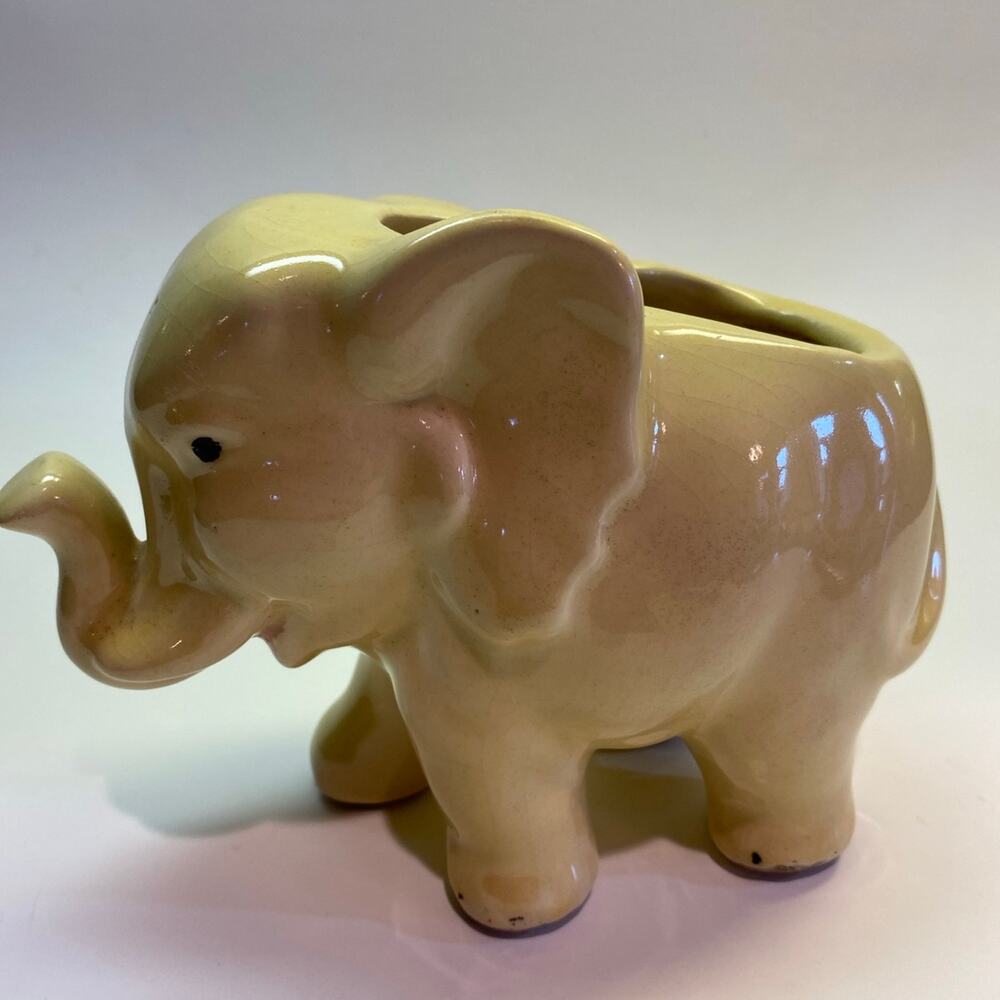 Vintage Elephant Planter. Solid soft yellow with black dots on eyes and feet.